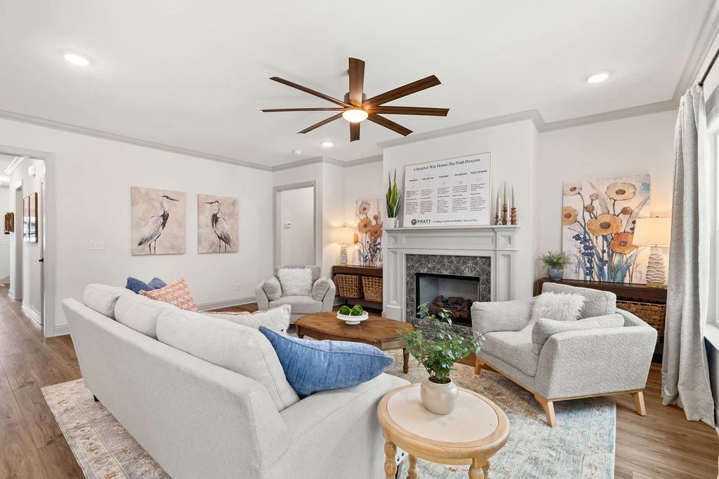 Modern living room by Pratt Home Builders in Chattanooga TN, featuring cozy seating, elegant fireplace, and stylish decor.