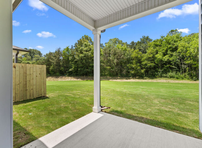 Outdoor covered patio for pets and gathering space new Pratt Home in East Brainerd