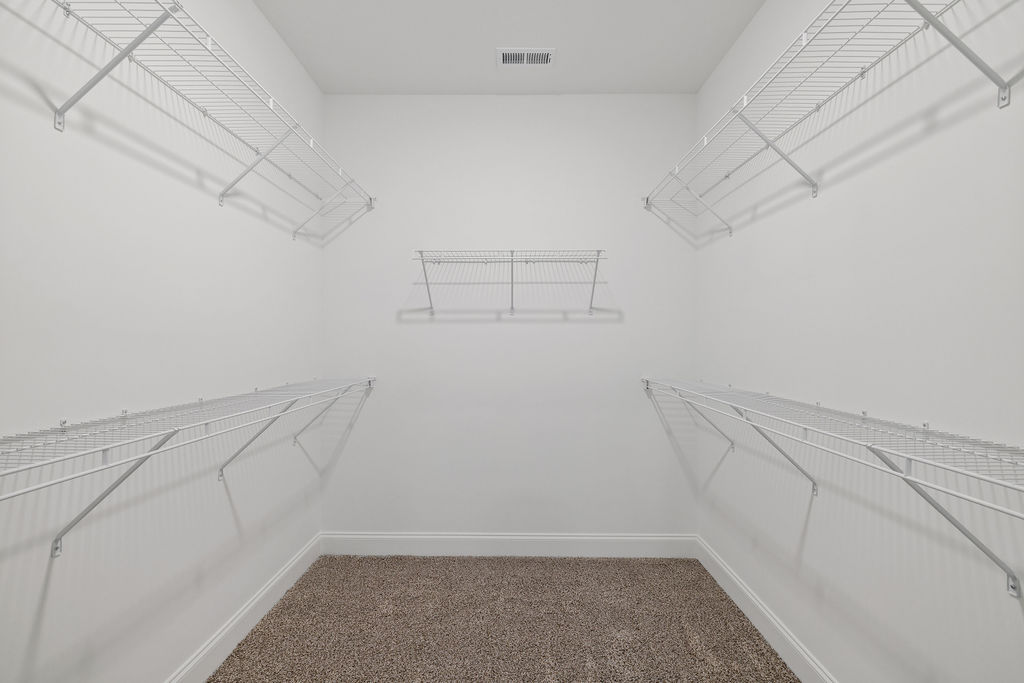 Large walk-in closet providing extra storage space