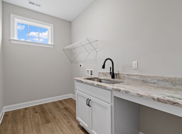 Spacious laundry room in new Pratt home for sale