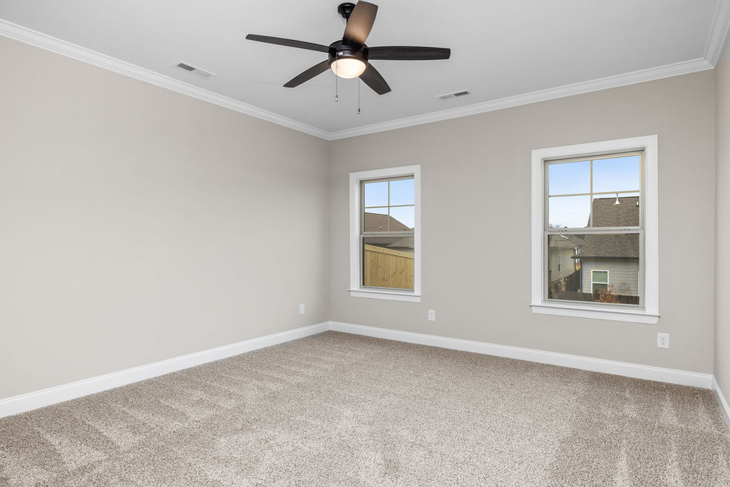 Primary suite with oversized windows in new home selling now