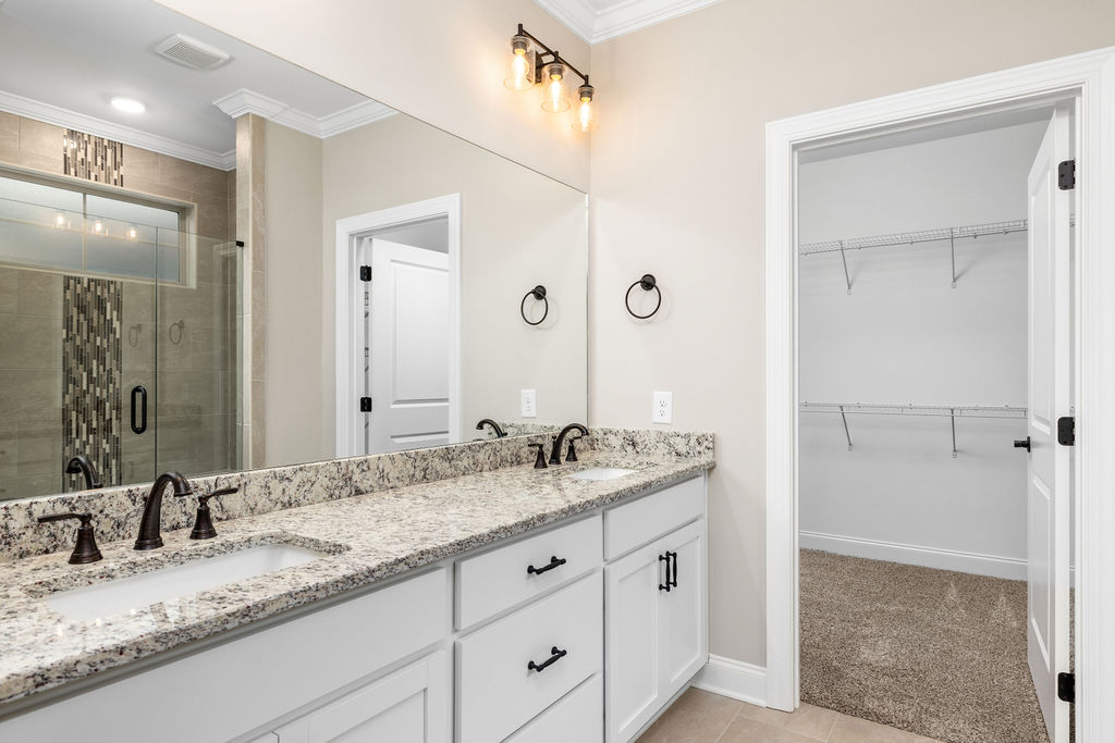 New home selling primary suite with double vanity