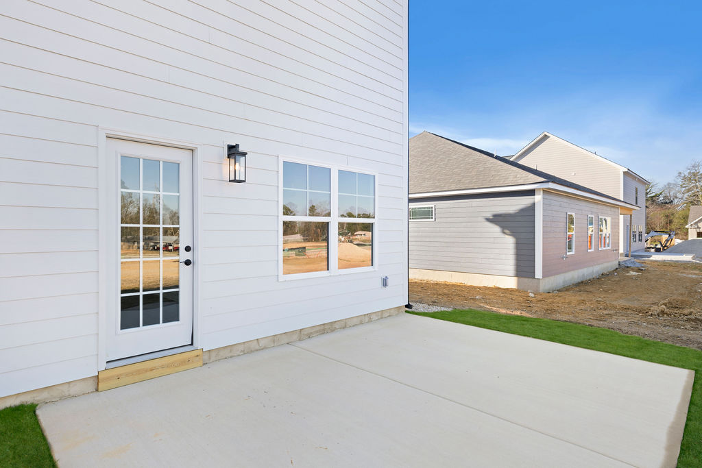 Backyard patio for this new home selling now