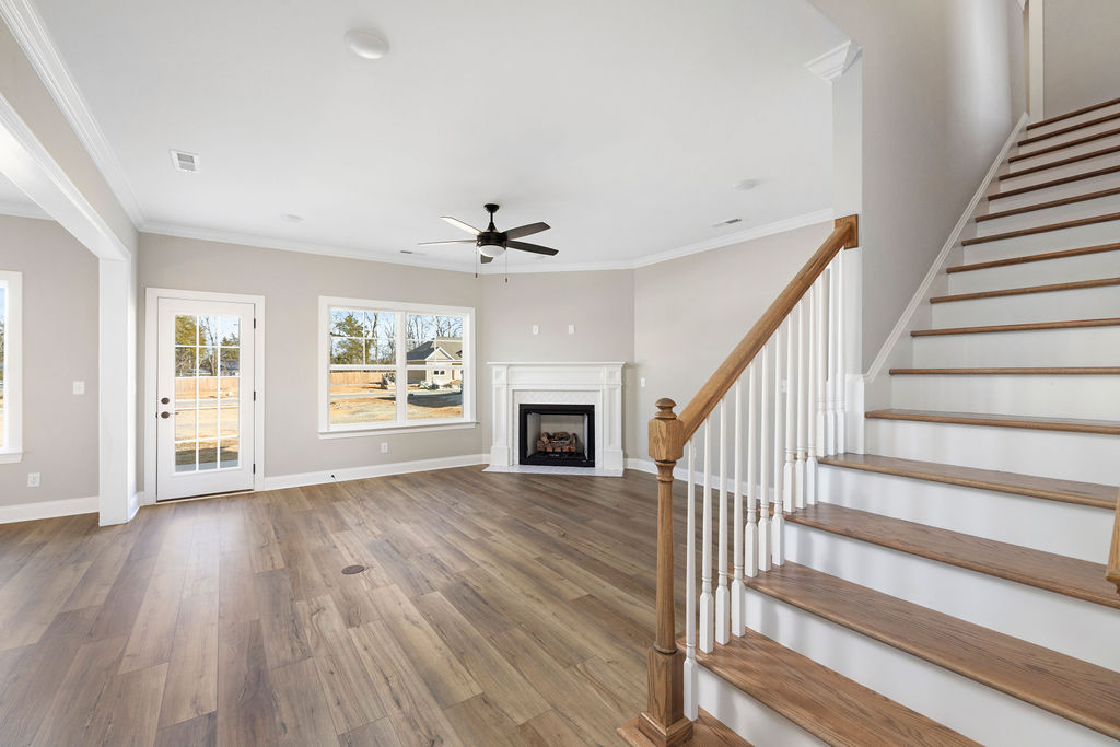 Open floor plan spacious windows in this new construction Pratt home