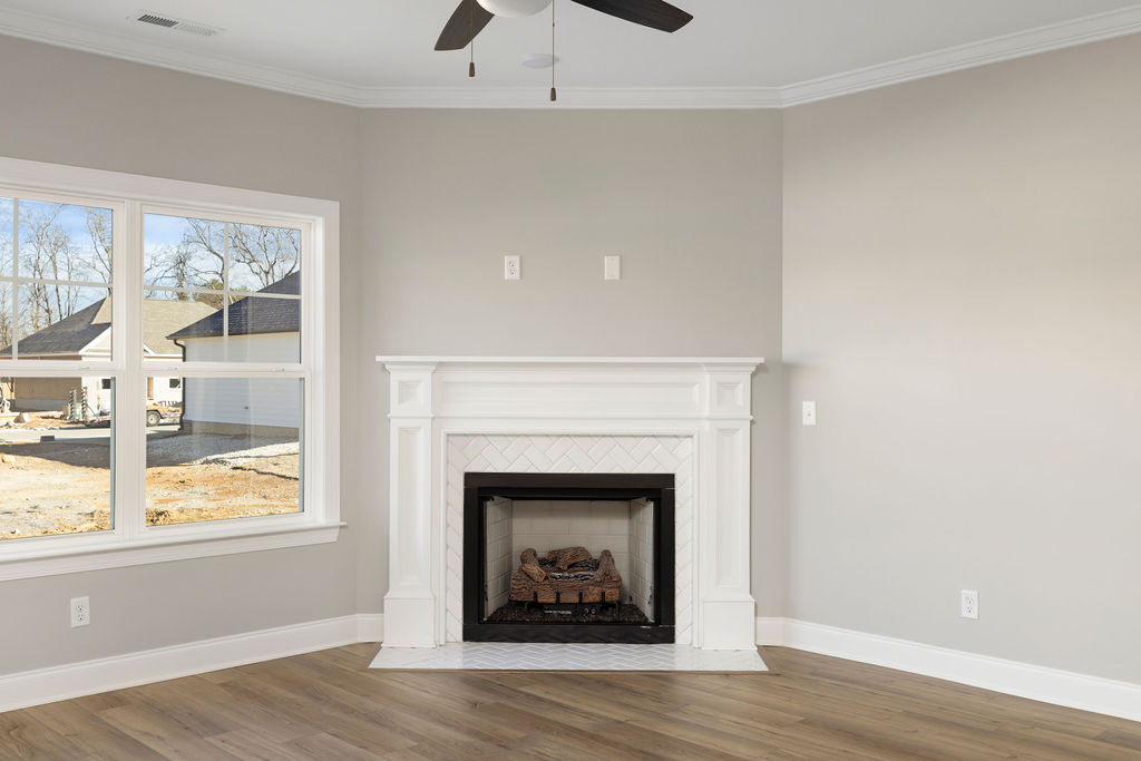 Designer fireplace serves as focal point in this great room of new home now selling in North Georgia