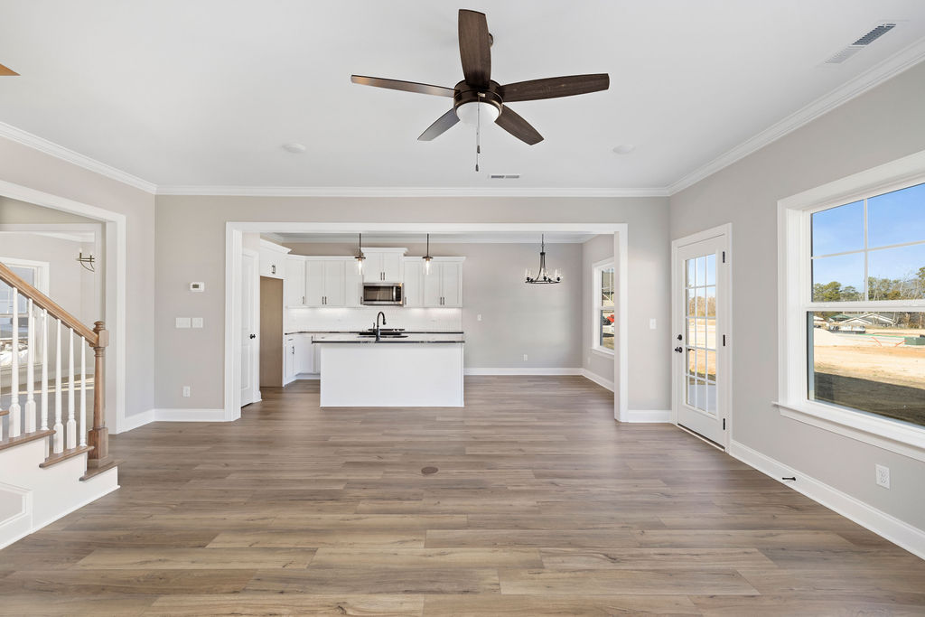 Oversized great room opens to designer kitchen in new home selling now
