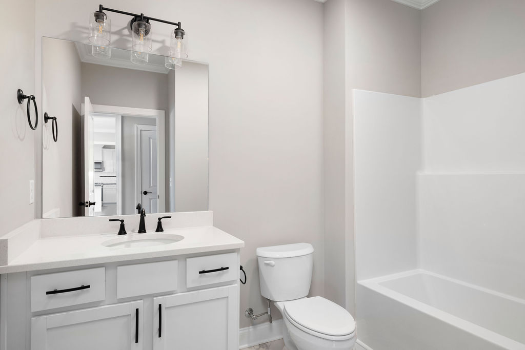 Full bathroom for guests and children in new home now selling