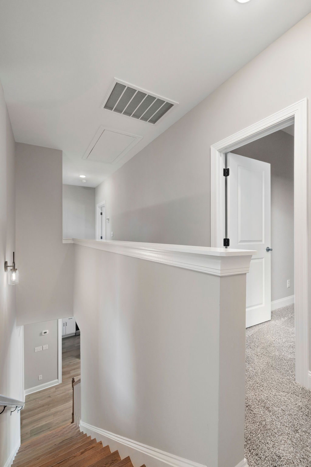 Second level landing opens to bedrooms