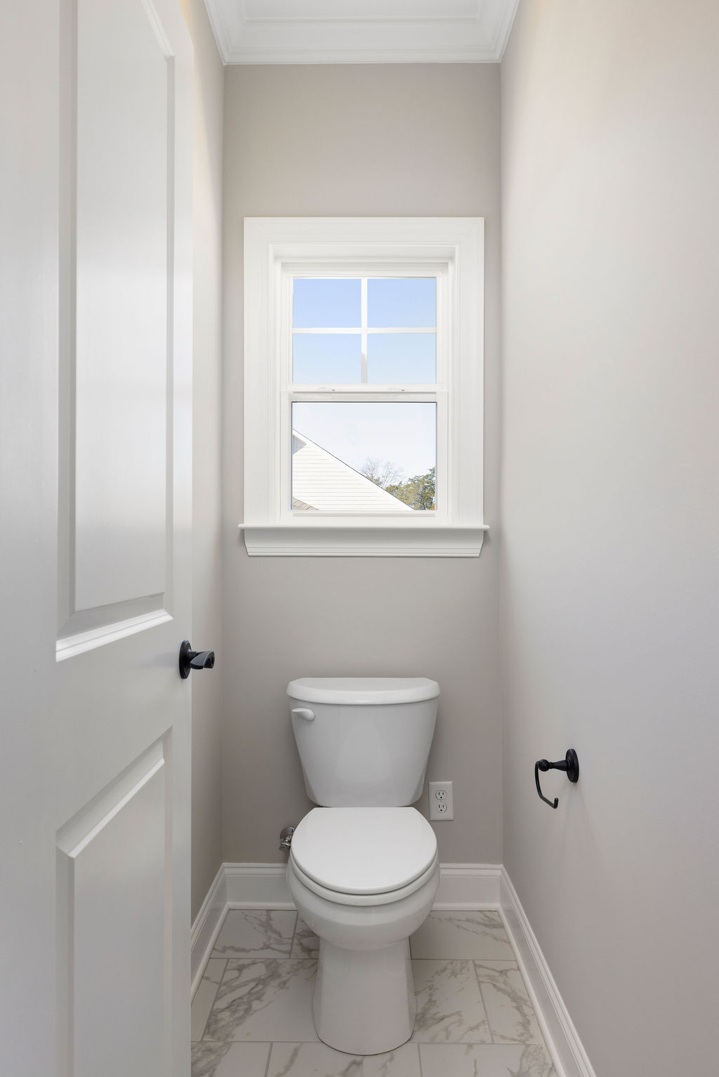 Water closet in primary suite provides privacy