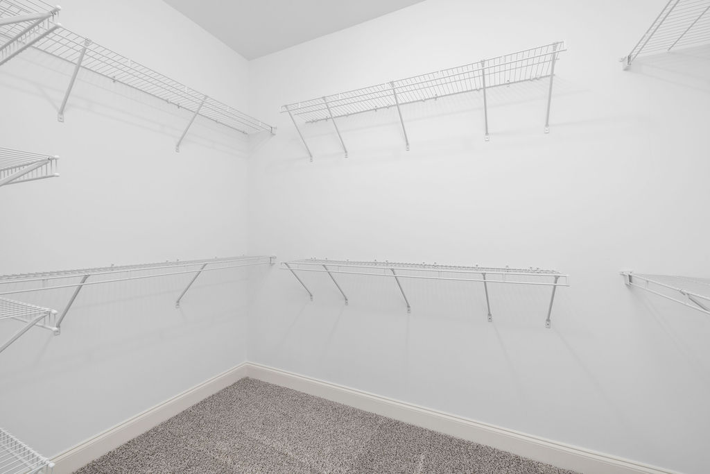 Oversized walk in closet in luxury townhome with extra storage now selling