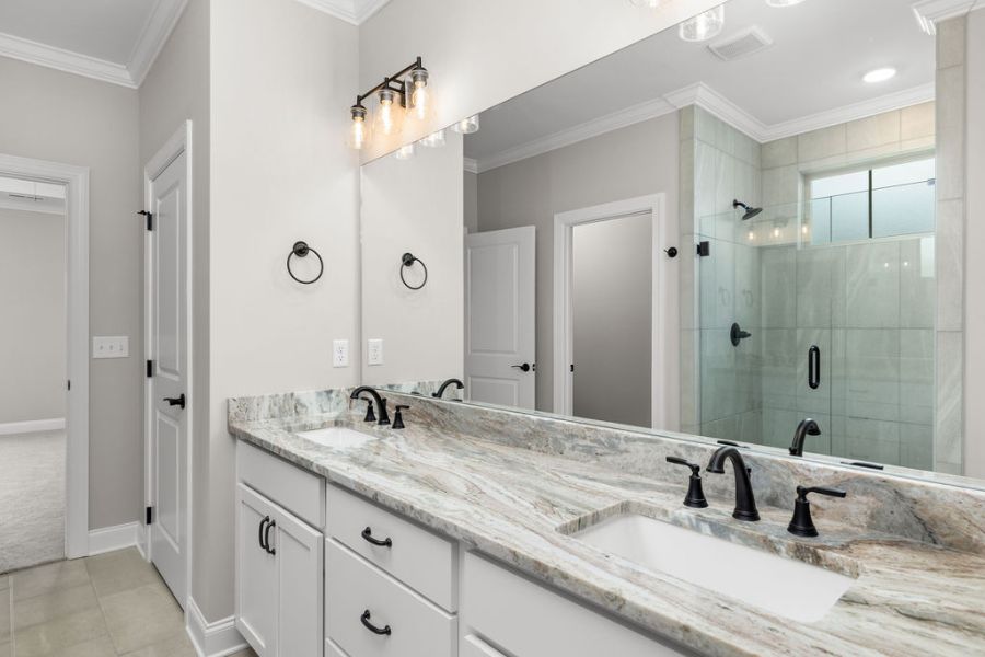Primary suite double vanity bathroom designer finishes