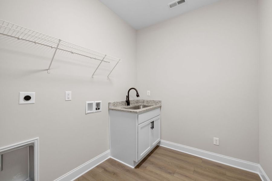 Laundry room in quick move-in home