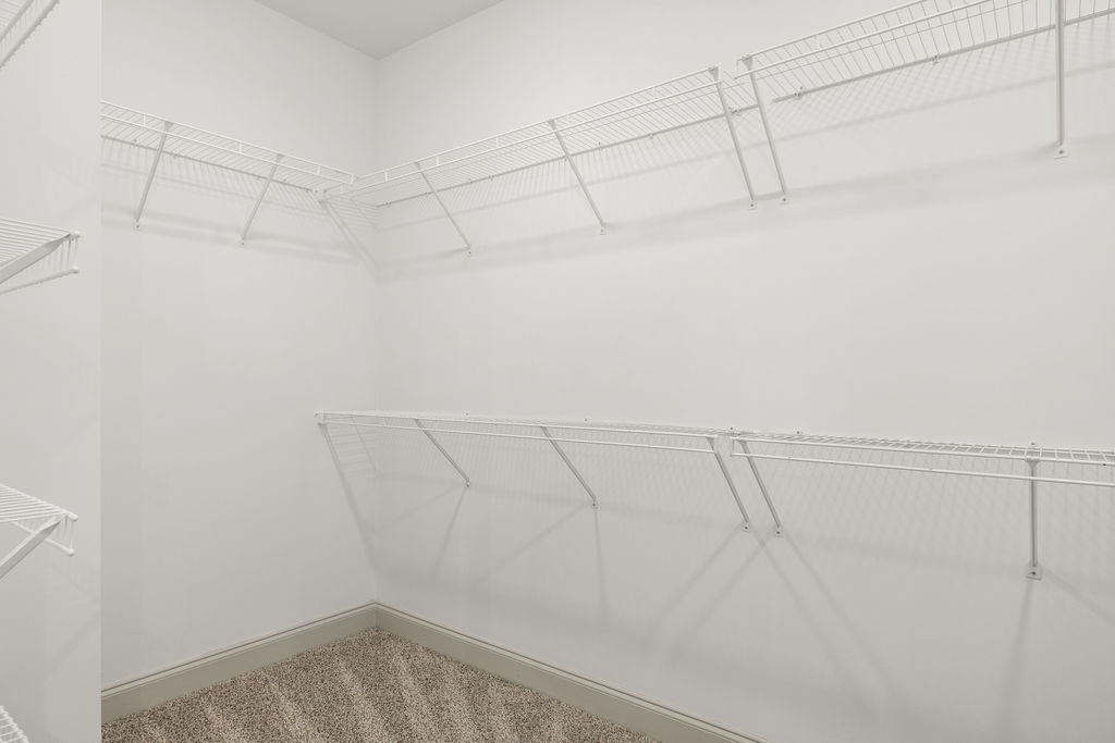 Walk-in closet and extra storage space in this new Pratt construction home selling now with 4 bedrooms