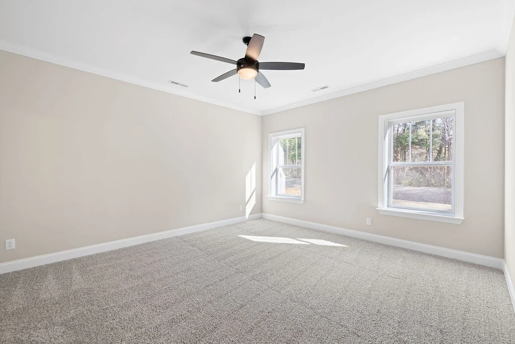 Spacious Primary Suite with two large windows, designed by Pratt Home Builders in Chattanooga TN.