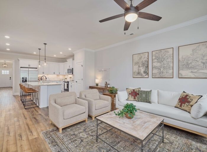 Open-concept living room with holiday decor in an Oakbrook home by Pratt Home Builders
