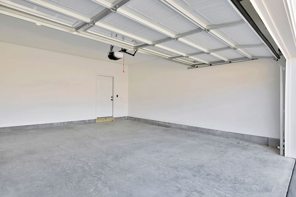 Spacious oversized two car garage on 4 bedroom new construction home available now