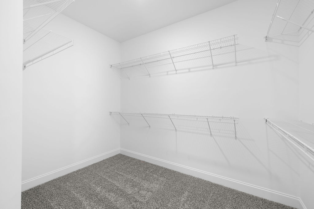 Large walk-in closet provides extra storage for this new Pratt home