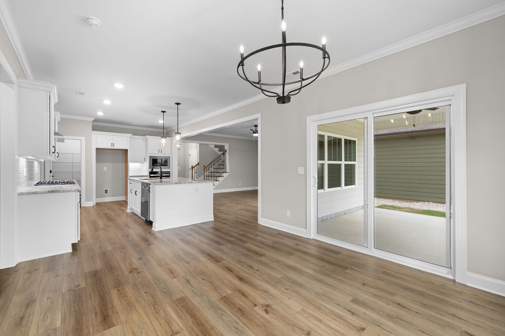 Dining room with elegant lighting eat-in kitchen Chattanooga new home selling now