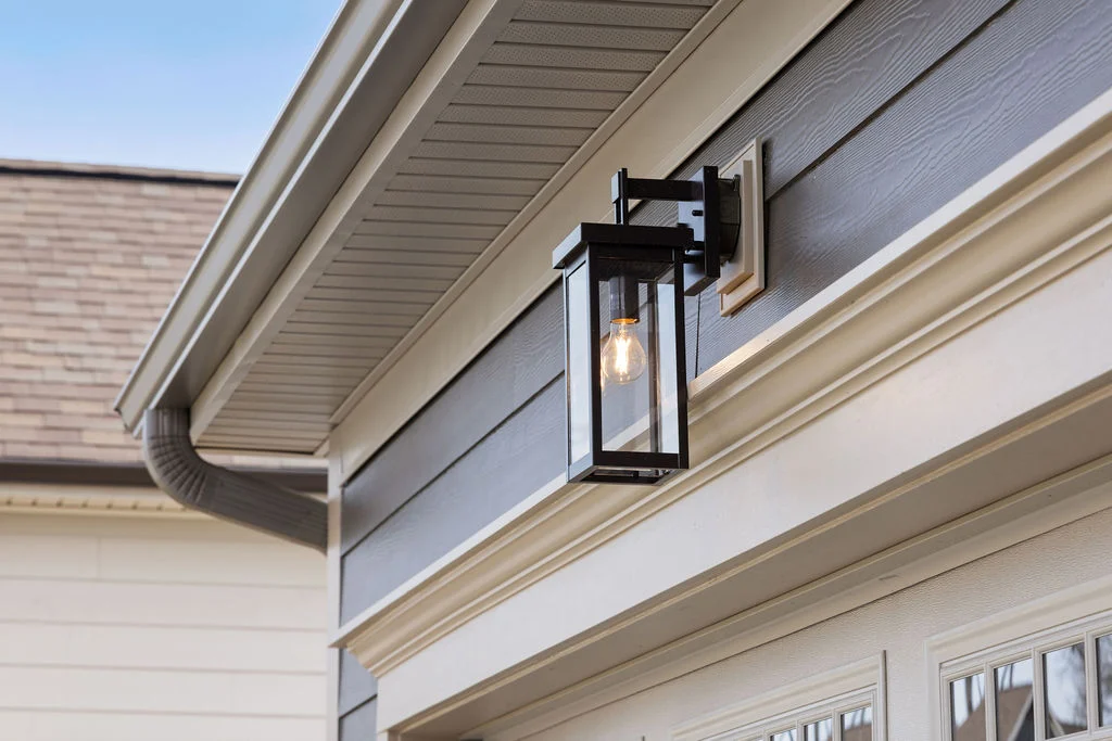 Exterior lantern light fixture on a gray house with detailed trim by Pratt Home Builders in Chattanooga TN.