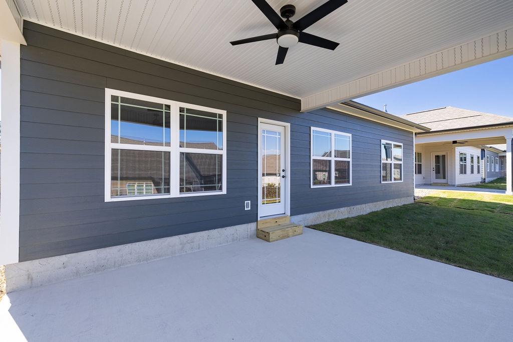 Outdoor patio and green space in this new home for sale by Pratt Home Builders