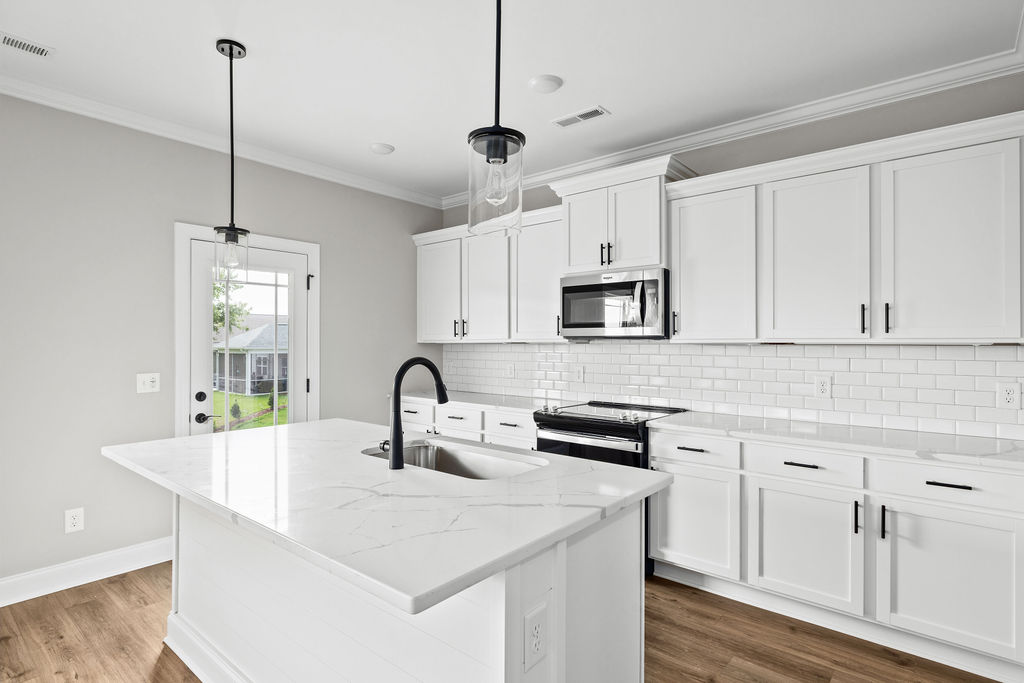 Open-concept kitchen in Chattanooga new construction home with quartz countertops