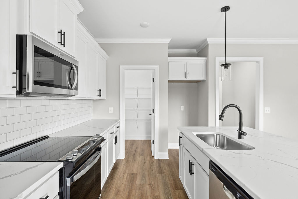 Chefs kitchen with designer finishes in East Brainerd new home now selling