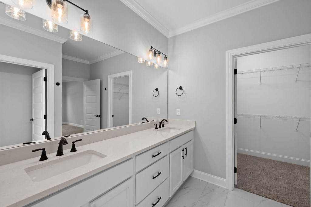 Primary Bathroom with double vanity in this new home selling in The Trails at Freewill