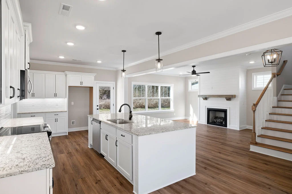 Open floor plan, chef's kitchen, all white with designer upgrades by Pratt Home Builders of Chattanooga, TN