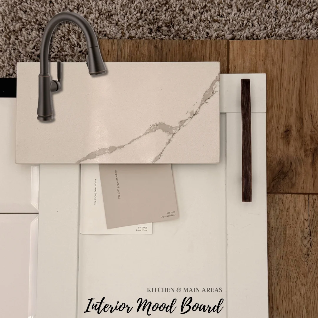 New Home Chattanooga TN. Interior mood board featuring faucet, marble countertop, paint samples, and wood flooring by Pratt Home Builders.