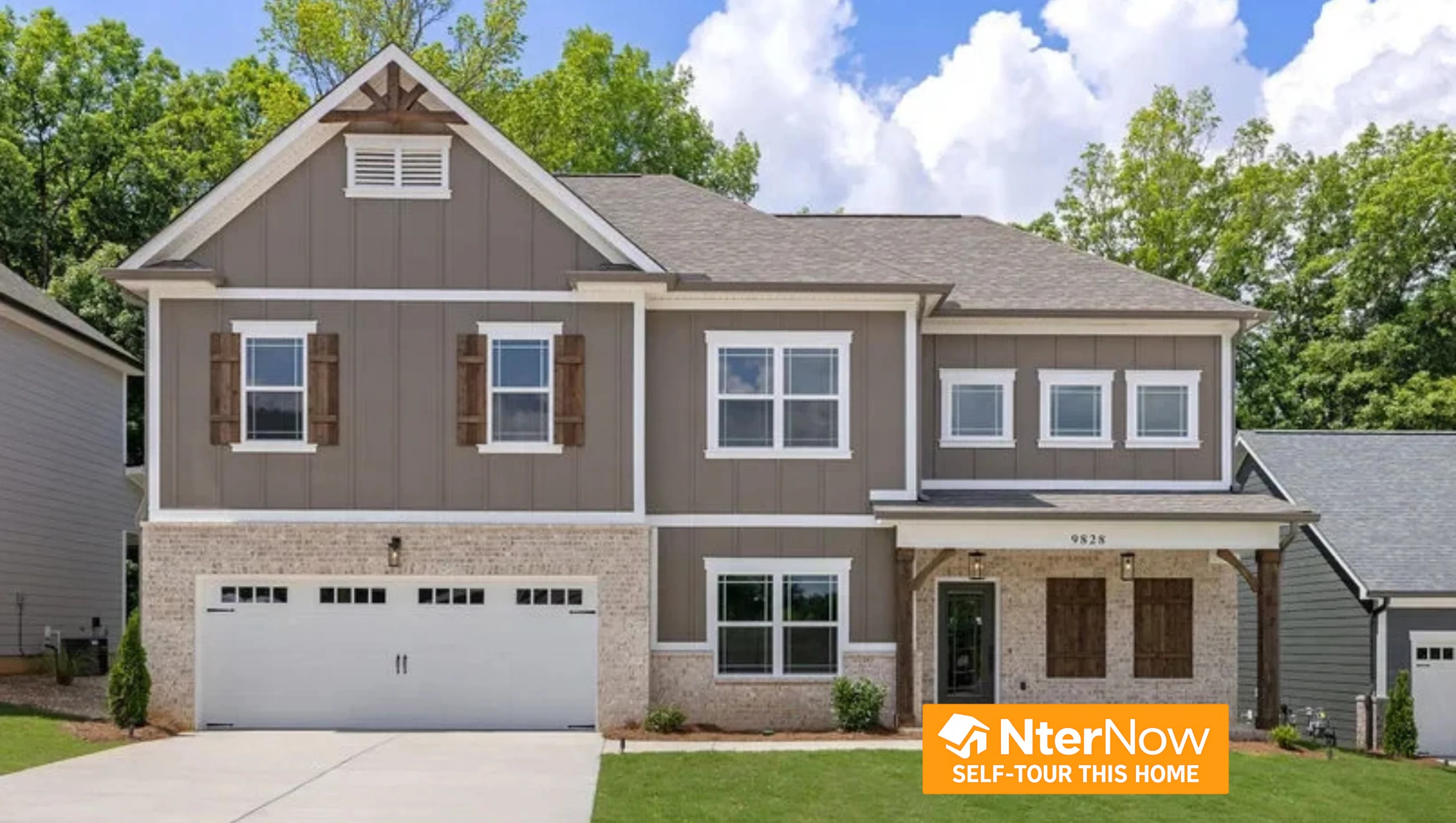 Two-story home with brown siding and white trim, featuring garage and wooden shutters. Built by Pratt Home Builders in Chattanooga, TN.