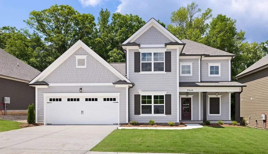 Modern two-story gray house with a double garage and manicured lawn by Pratt Home Builders in Chattanooga TN.