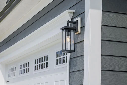unnamed (1) Exterior lantern light on white garage with dark gray siding, part of Pratt Home Builders in Chattanooga TN design.