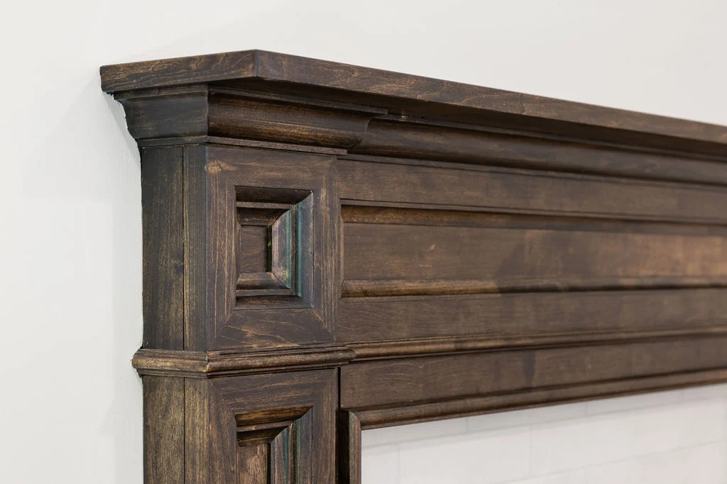 Ornately carved wooden mantel detail, showcasing Pratt Home Builders in Chattanooga TN craftsmanship.