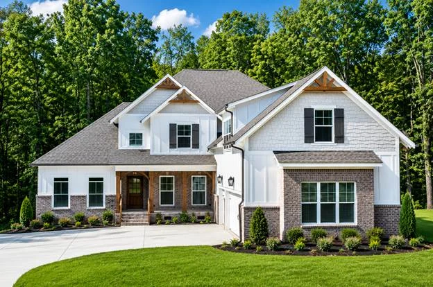 Spacious suburban home with brick and white siding, lush landscaping, located in a wooded area, built by Pratt Home Builders in Chattanooga TN.