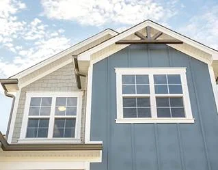 image006 Blue and gray house exterior with white-trimmed windows and decorative gables, built by Pratt Home Builders in Chattanooga TN.